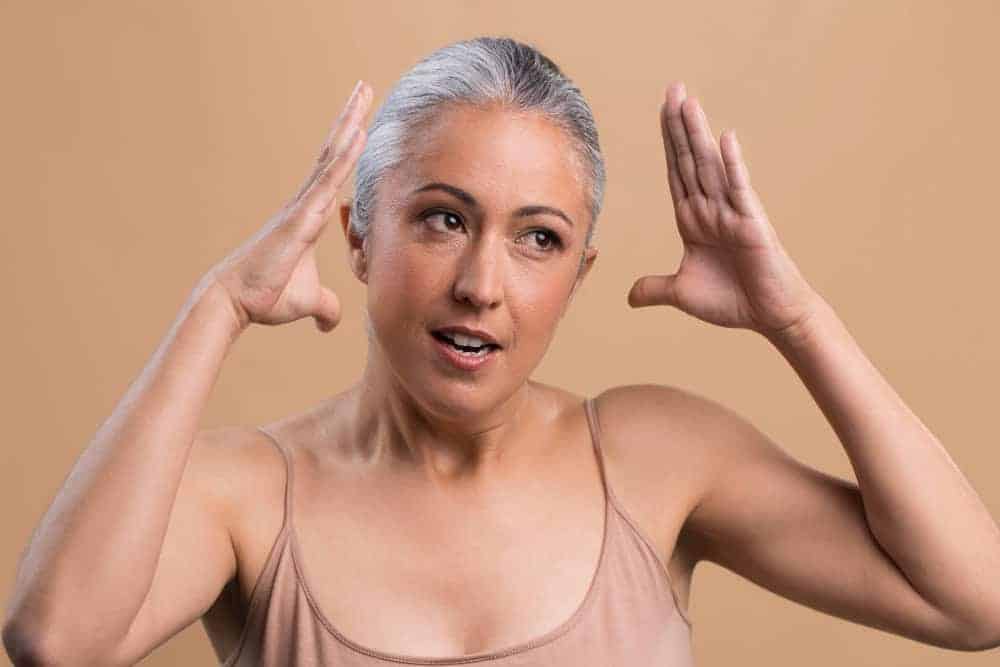 Woman experiencing skin and hair changes